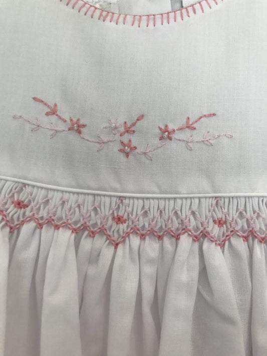 White smocked long sleeve dress